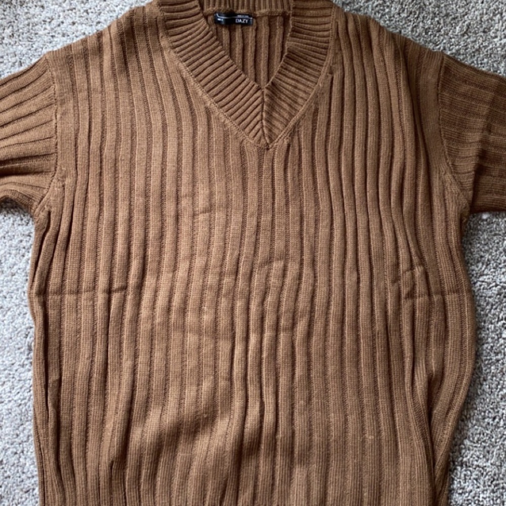 I’m selling a brown sweater, from Dazy. Size medium.